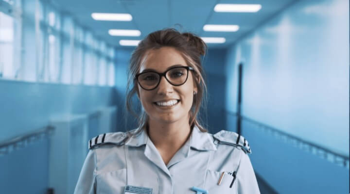 One woman standing with smiling face